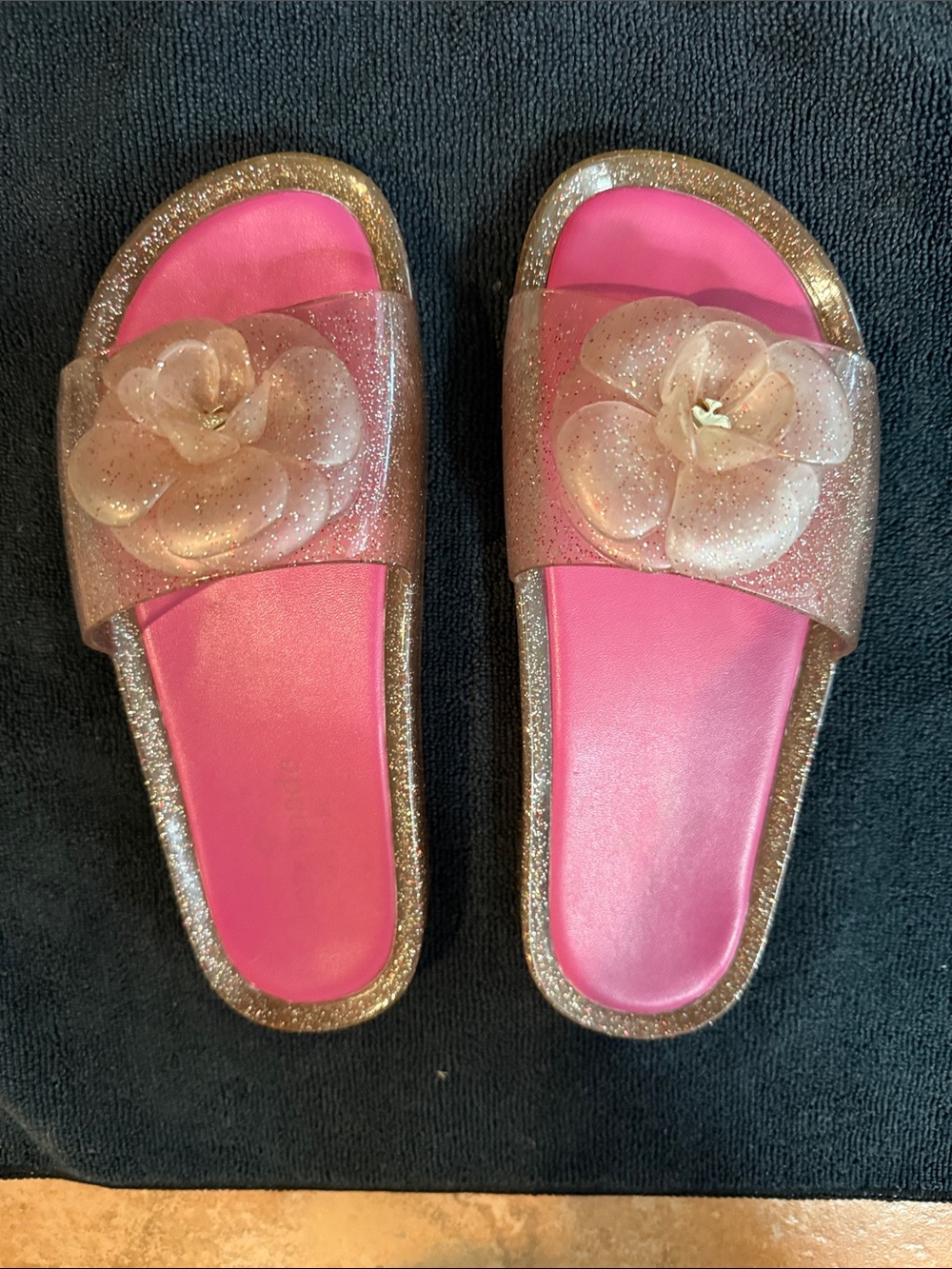 Pink Kate Spade Glitter Floral Slide Sandals.